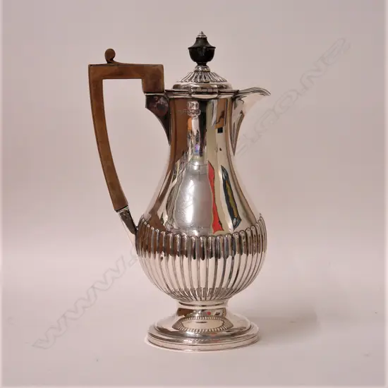 A Victorian baluster silver hot water pot