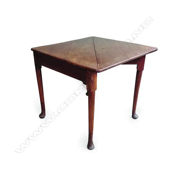 A late Victorian oak triangle drop-leaf table