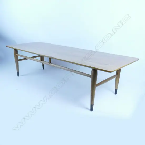 A mid-20thC teak long coffee table