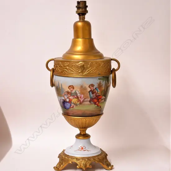 A 20thC European porcelain and ormolu classical lamp base in the Dresden manner