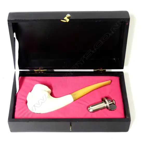 A meerschaum bowled pipe with amber stem