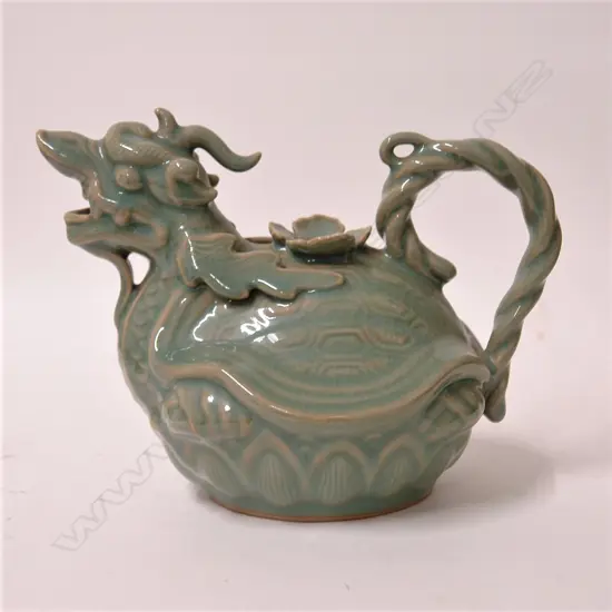 A celadon glazed figural teapot