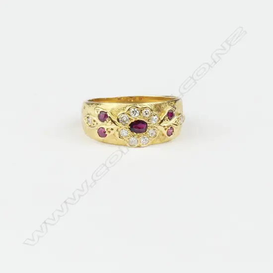 An 18ct gold diamond and ruby ring
