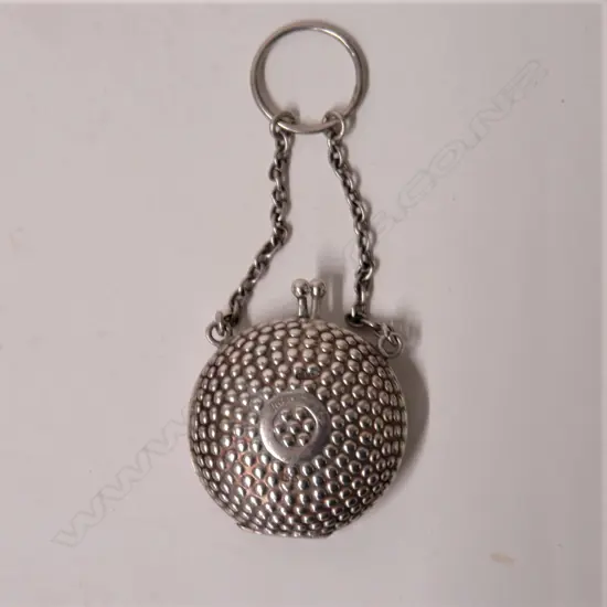 An Edwardian silver lady's finger suspended vanity case