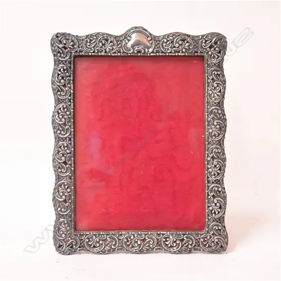 A late Victorian large decorative silver photo frame