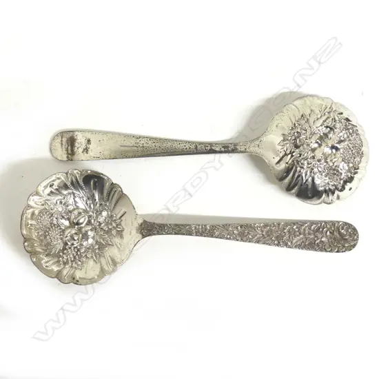 A pair of American silver large berry spoons