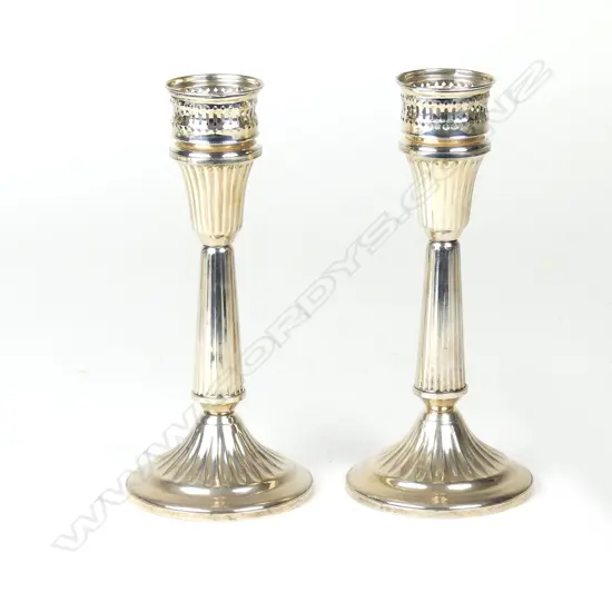 A pair of American Duchin silver column candlesticks