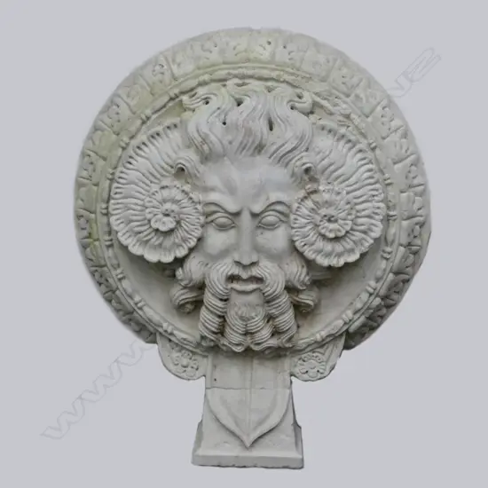 A 'marble' garden ornament depicting the head of Jupiter