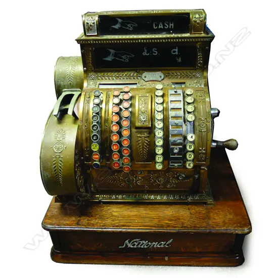 A vintage large brass National cash register