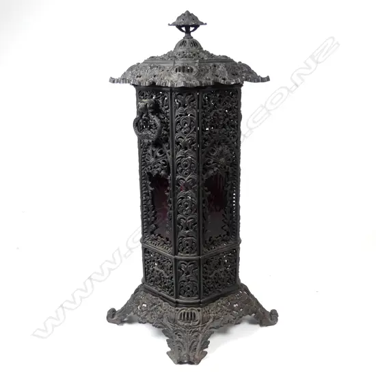 A Victorian decorative cast iron kerosene room heater