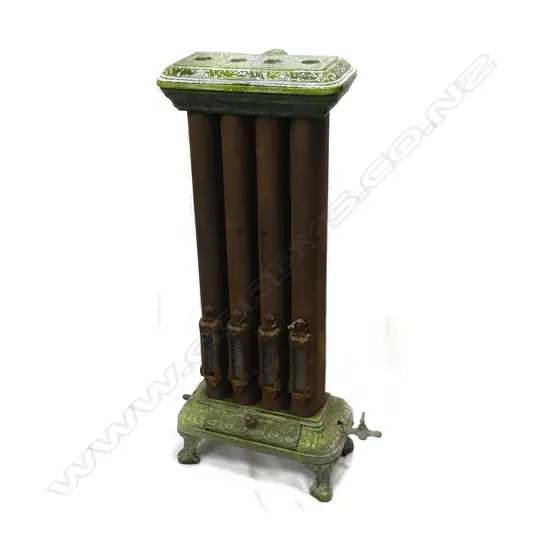 A late 19thC four burner gas room heater