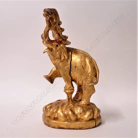 A Chinese carved and gilded hardwood temple elephant