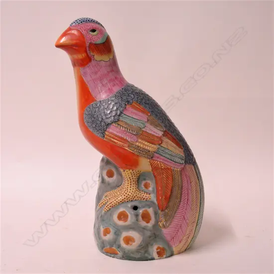 A 20thC Chinese polychrome porcelain parrot