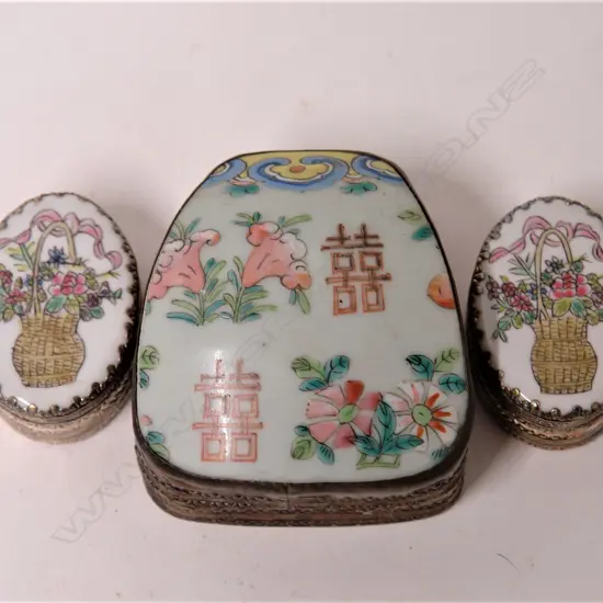 Three enamel painted porcelain panelled lidded boxes