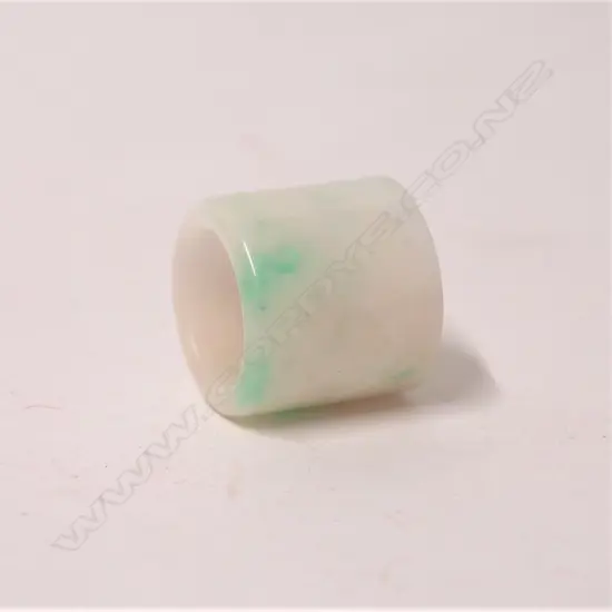 A Chinese white mottled jade archer's ring