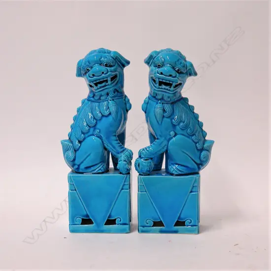 A pair of Chinese turquoise glazed foo dogs