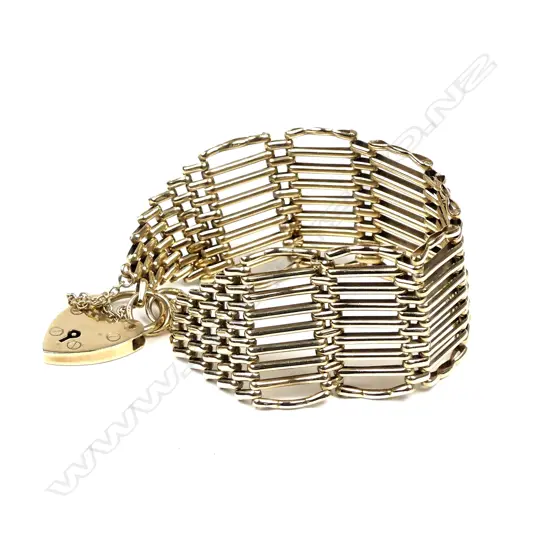 A 9ct. yellow gold wide quality gate link bracelet