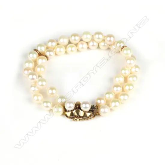 A double row cultured pearl bracelet with gold clasp
