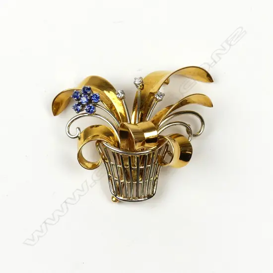 A vintage 18ct. yellow gold sapphire and diamond flowering basket form brooch