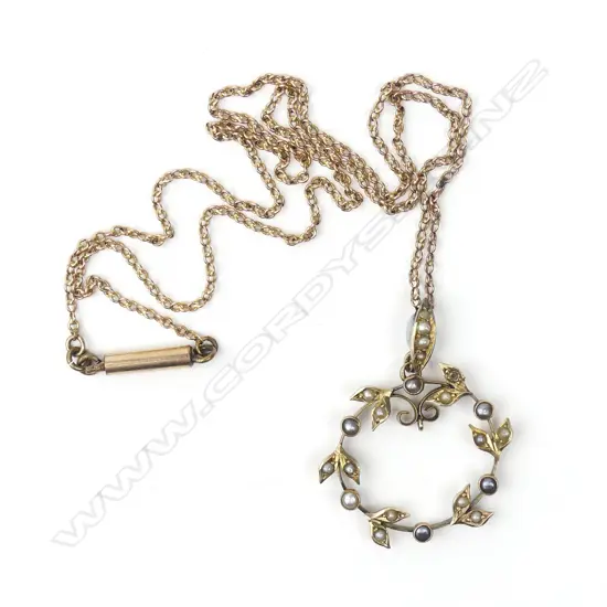 An Edwardian 9ct. yellow gold and seed pearl pendant necklace