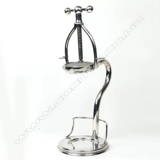 An early 20thC silver plate lemon squeezer