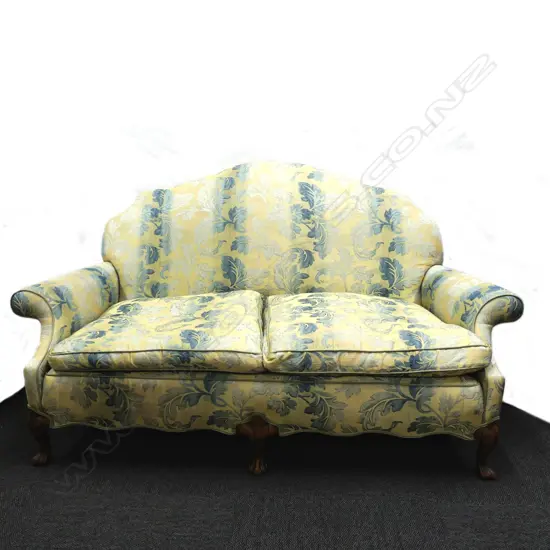 A Georgian style mahogany camel back two-seater sofa