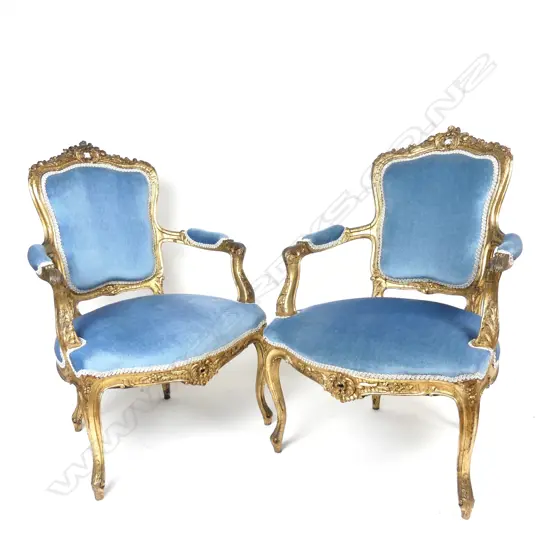 A pair of French Louis XV style fauteuils