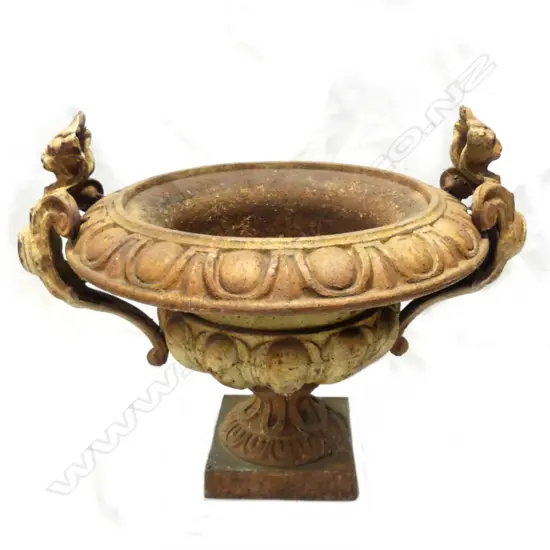 An old cast iron garden urn