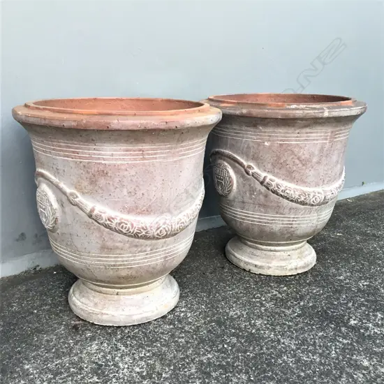 A pair of large Versailles pedestal urns