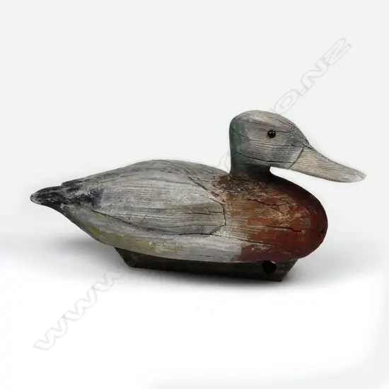A late 19thC carved wooden duck decoy