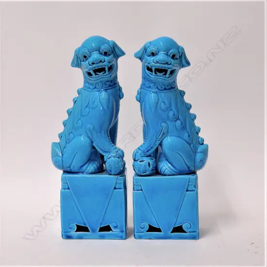 A pair of Chinese turquoise glazed foo dogs