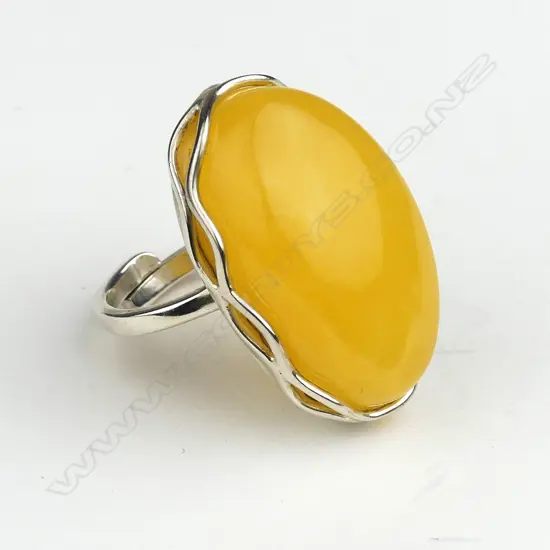 An amber and silver ring
