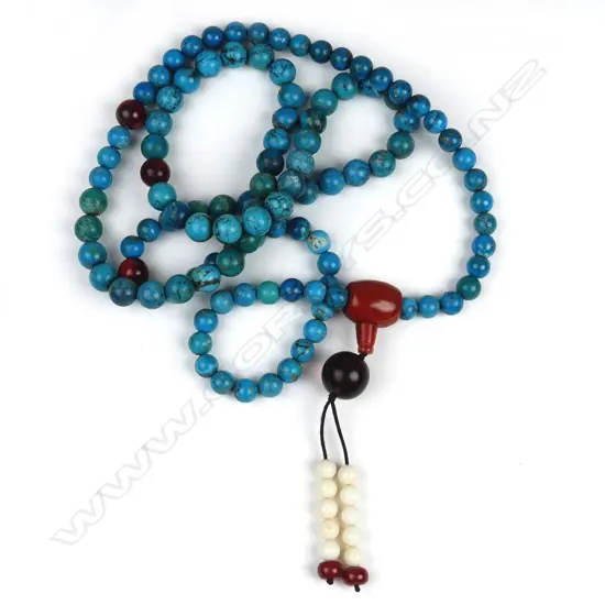 A long turquoise mala bead necklace