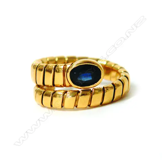 An 18ct. yellow gold and sapphire snake style ring