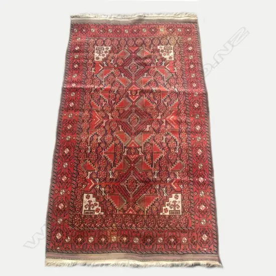 An antique Persian hand knotted rug