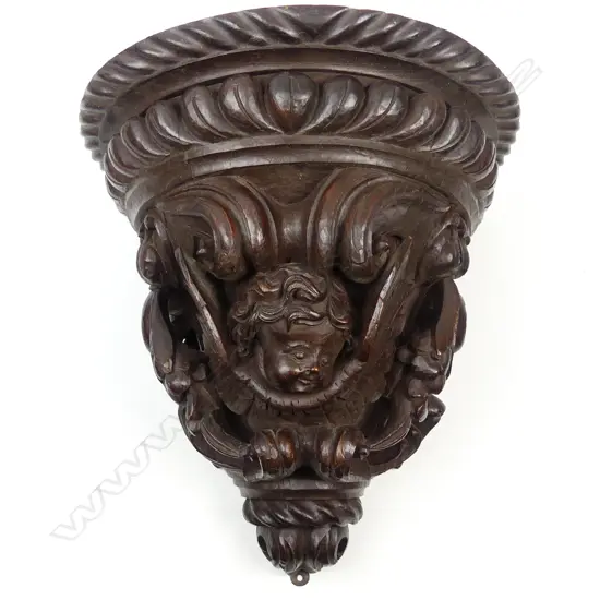 A late 19thC oak carved wall bracket