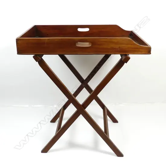 A mahogany butler’s tray top table