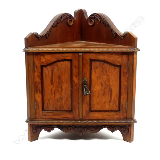 A small kauri corner cabinet
