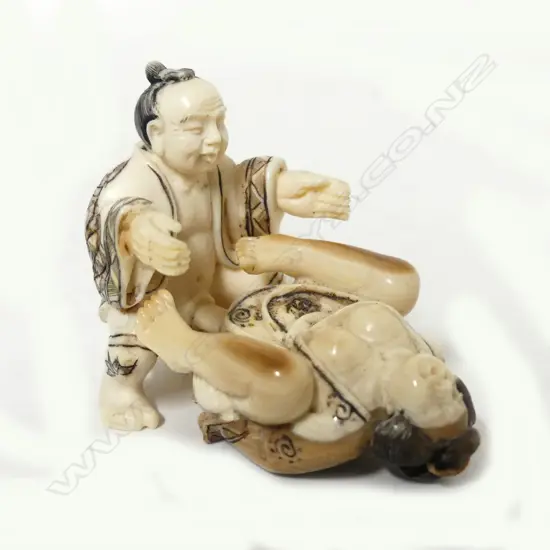 A small Japanese ivory two piece erotic carving