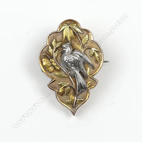 A stylish late 19thC 15ct. tri-coloured gold memorial brooch