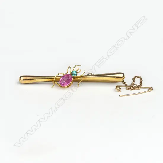 A vintage 9ct. yellow gold and coloured stone inset bar brooch