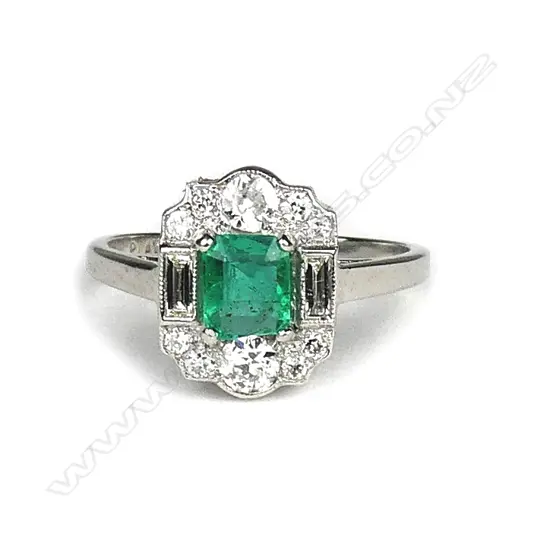 An 18ct. white gold Art Deco emerald and diamond dress ring