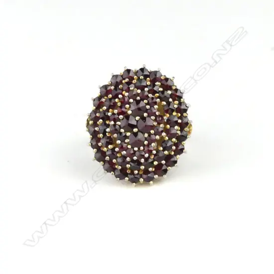 A vintage Bohemian garnet and gold plated ring