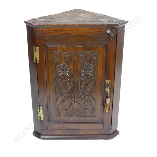A Georgian oak country corner cabinet