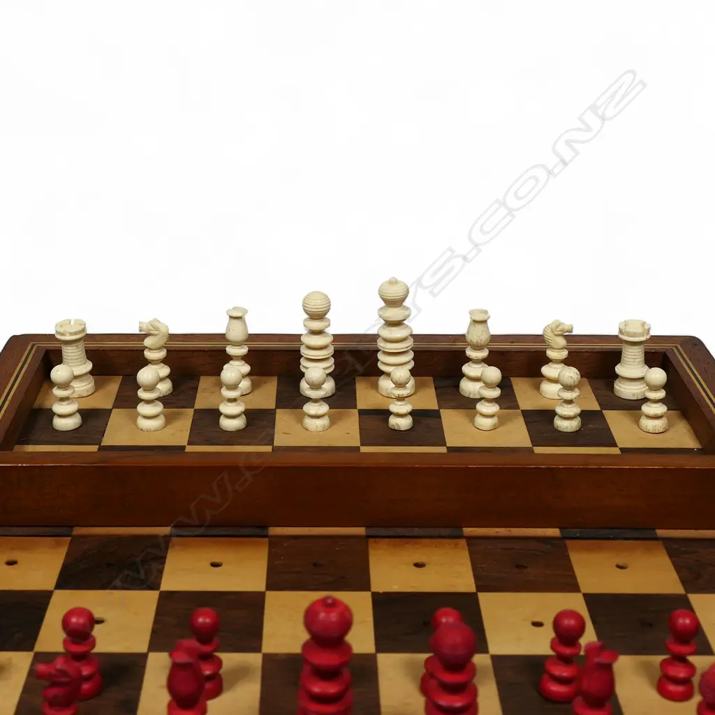 A Victorian travelling turned carved and part red stained bone chess set, Image 1++