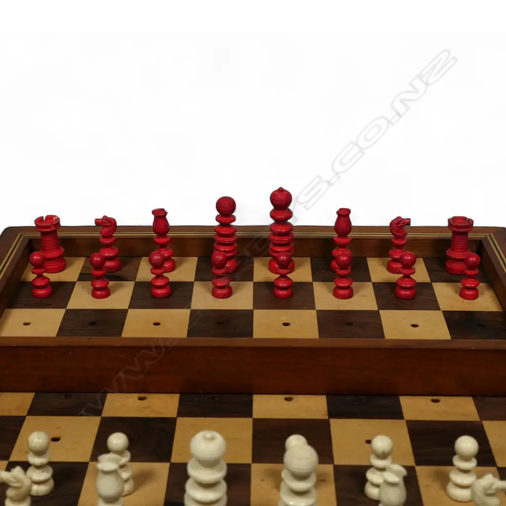 A Victorian travelling turned carved and part red stained bone chess set, Image 1++