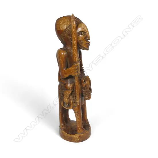 An early 20thC Nigerian carved ivory figure,