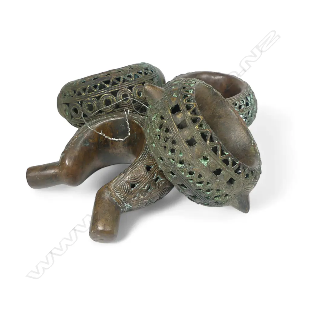 Four early 20thC Benin bronze currency bangles, Image 1++