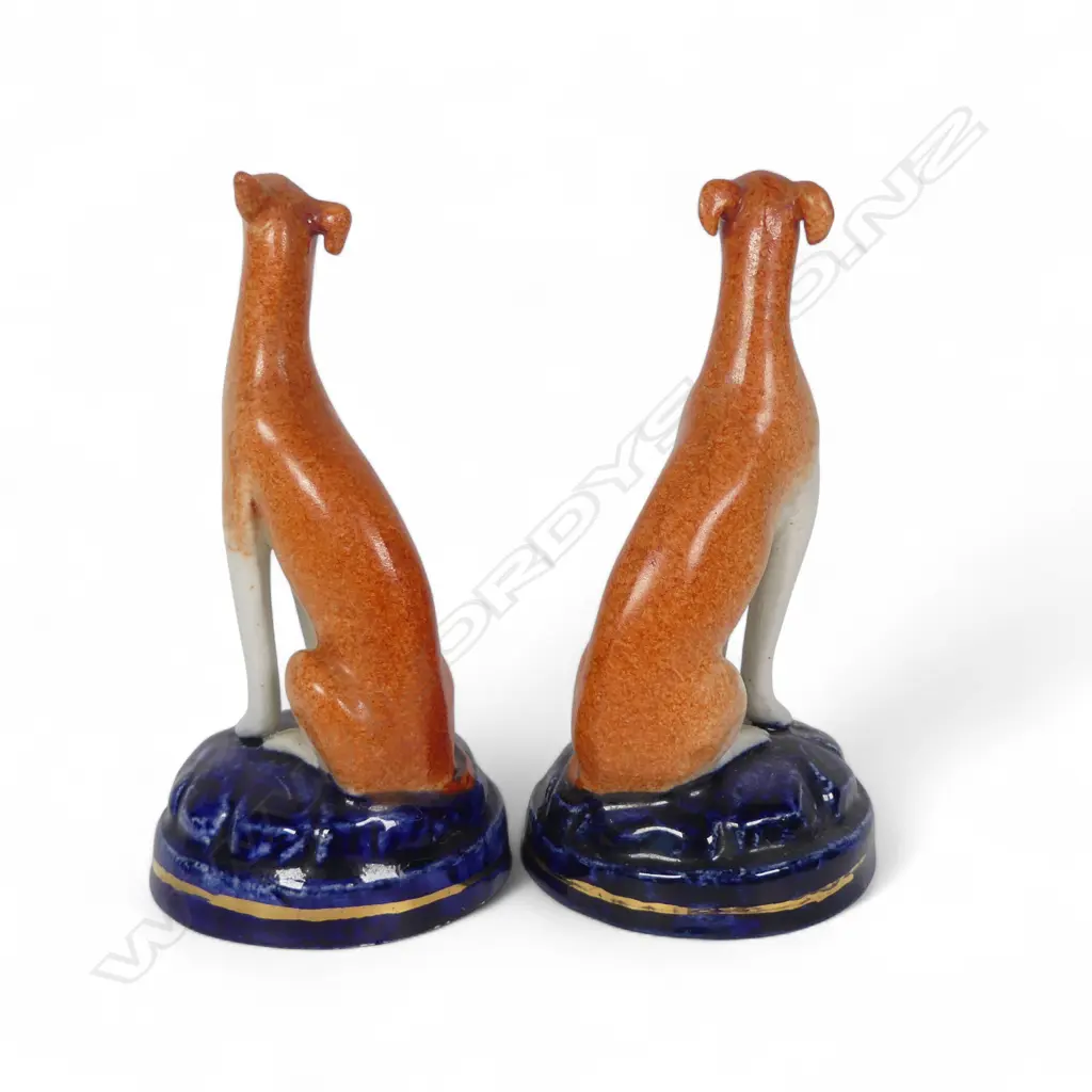 A pair of Victorian Staffordshire small seated hounds, Image 1++