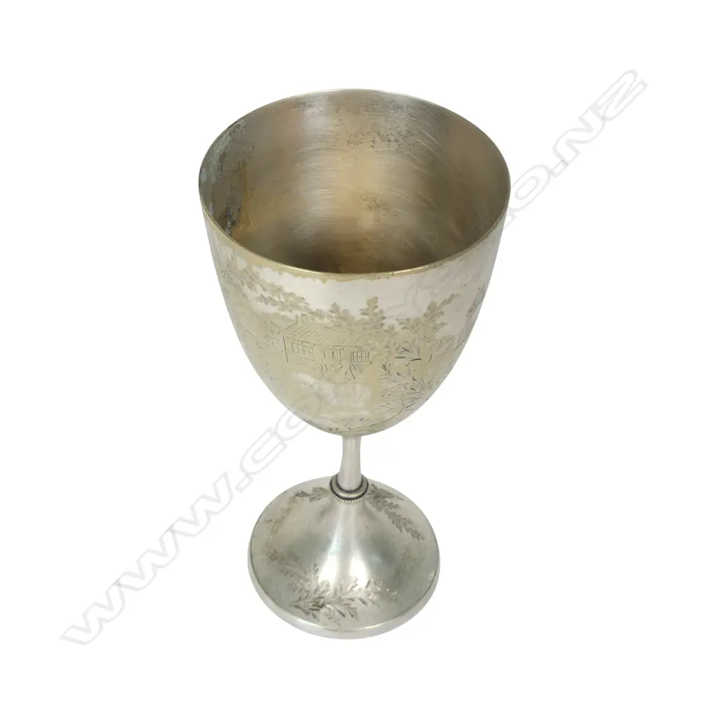 A late 19thC New Zealand historical silver plate trophy cup, presentation engraved ' Dunedin Bowling Club Rink Match 1887 Won By James Anderson. The front engraved with a bowling scene. The plating worn. H.210mm. Image 1++